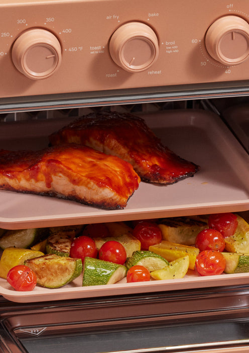broiling salmon and vegetables in pink wonder oven