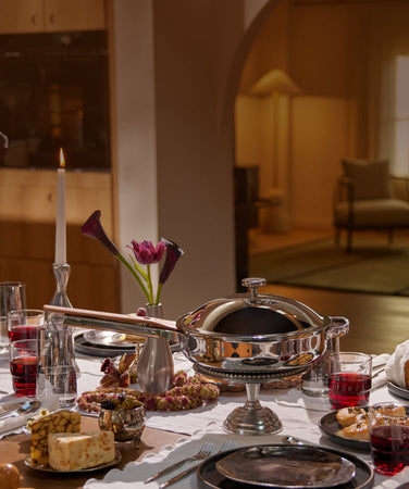 holiday tablescape with titanium always pan pro and our place dinnerware assortment