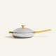 Titanium Always Pan Pro 26 cm (2.0) silver stainless steel frying pan with a matching lid and metallic gold handles.