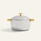 Titanium Perfect Pot Pro 7 L, a silver-toned cooking pot with a lid and gold-colored handles and knob.