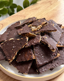 a pile of matzo toffee on a white plate